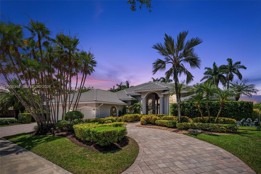 Stunning single-story estate in the exclusive Weston Hills Country Club, set on an oversized 0.41-acre waterfront lot with over 5,800 total square feet. This exceptional residence showcases soaring ceilings—higher than any other floor plan—and an elegant, open design throughout. Featuring 6 spacious bedrooms, 5.5 luxurious bathrooms, and a 3-car garage, the home has been beautifully updated with polished marble floors, fresh interior paint, a new roof, three new A/C units, and all-new impact windows and doors.  Designed for both grand entertaining and everyday living, the spectacular chef's kitchen boasts the latest in contemporary design and premium finishes, all overlooking the resort-style pool and breathtaking infinity lake views. Located within a prestigious golf course community and zoned for top-rated A+ schools, this remarkable estate offers the ultimate Weston lifestyle.