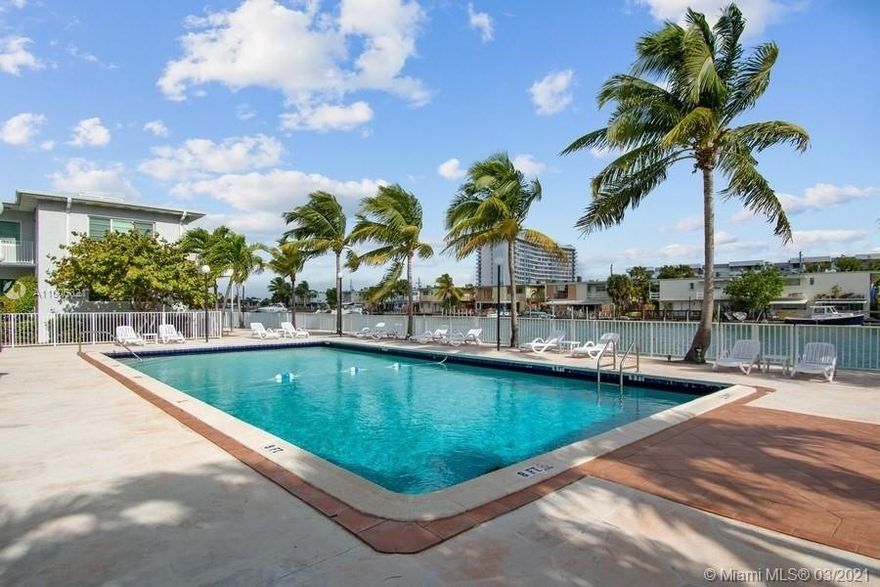 Charming 1/1 unit on waterfront property. Courtyard Style Building. Open floor plan with separate dining and living room. Original wood floors. Impact windows. Updated kitchen w/ stainless steel appliances. BONUS: Washer/dryer in unit. Fenced Pool & BBQ area right on the water. Private & secure. Walking distance to restaurants & Beach. Close to supermarkets, restaurants, and more.