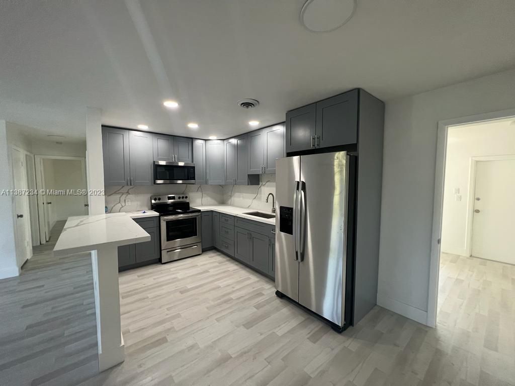 Photo of 124 NE Entrada Ave, Port Saint Lucie, FL 34952 (MLS # A11387234)