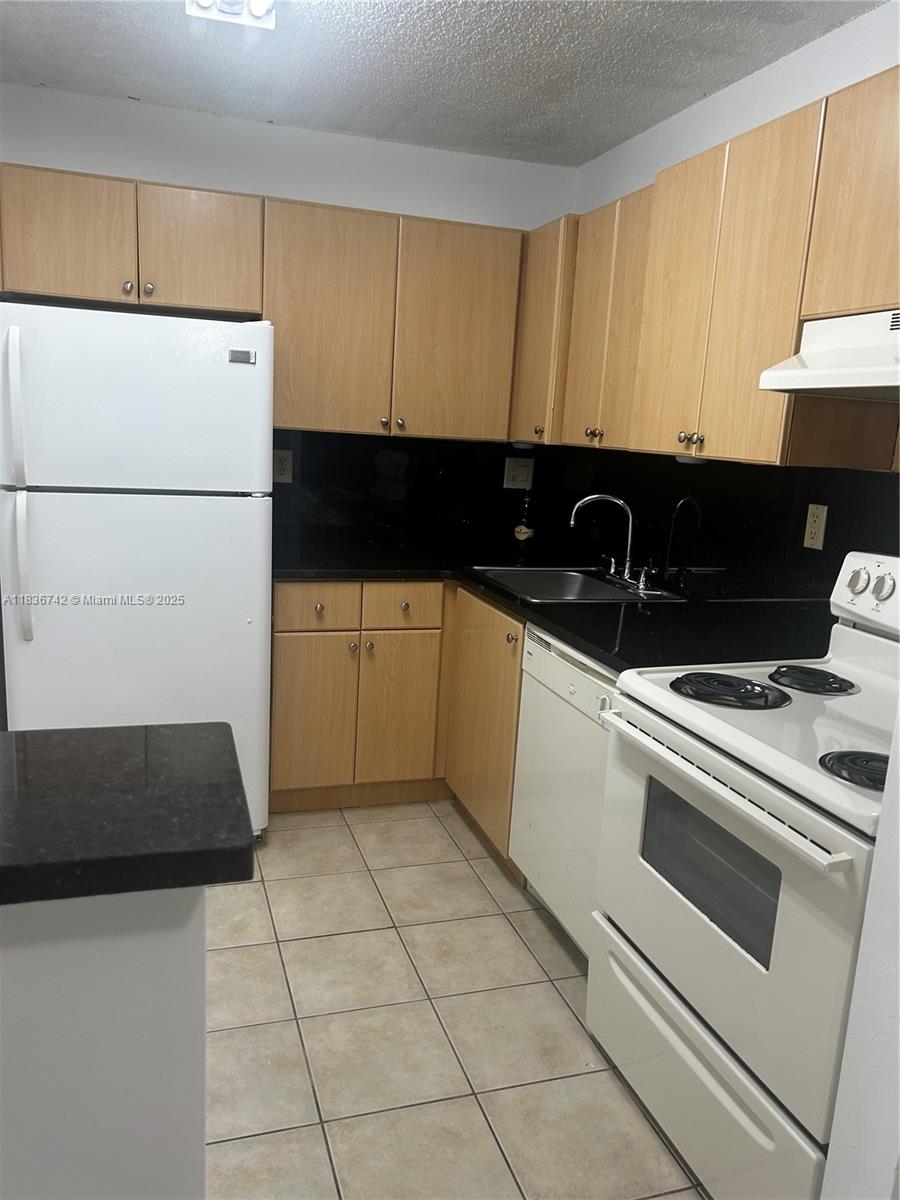 Calling all investors! Charming apartment located on the first floor of sought after Villa Bellini. This unit comes with a brand new AC unit, washer and dryer inside, renovated bathtub walls, granite counters. Ideal location, close to main avenues, major highways and lots of shopping and restaurants. It is tenant occupied until October 31st, 2025. Tenant is paying $1850. Investor friendly. Can be rented right away.