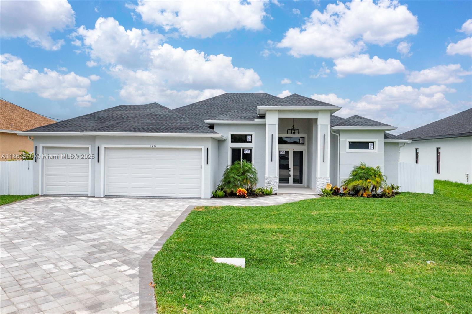 Modern Waterfront Luxury with Smart Home Features! 4 Beds | 3 Baths | 3-Car Garage | 2,236 Sq Ft | Saltwater Pool. This stunning Cape Coral home features 13’ ceilings, Spanish tile floors, and an open-concept layout with expansive 125-ft canal views and seawall. Chef’s kitchen with smart appliances, formal dining area, 8x12 wine wall, and spa-inspired bathrooms with smart toilets. Outdoor Florida kitchen with 15x30 heated saltwater pool and spa jets. Fully automated lighting, sprinklers, energy-efficient LED fixtures, and all city water/sewer assessments paid. Minutes from shopping, dining, and schools, combining luxury, technology, and waterfront living.