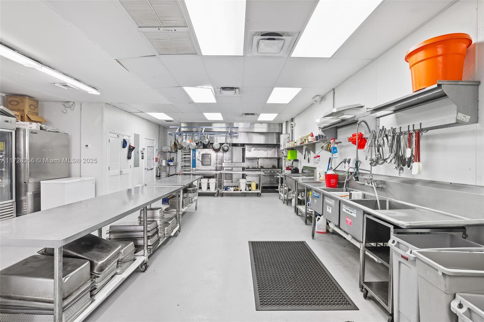 Fully equipped commercial kitchen with REAL ESTATE INCLUDED, is located in the highly sought-after Bird Road Design & Industrial District. This professional set up is full of high end culinary equipment including two 3-door refrigerators, one 3-door Freezer, Walk-in Cooler, American Range Double Convection Oven, American Gas Range, 3 Compartment Sink, Cooling Racks, Tables, Bins, plus plenty of Master Chef and Pastry specialty items and much more. 3-phase power, natural gas, tankless water heater, 12' hood, grease trap and private accessible bathroom, low HOA fee, includes 3 parking spaces. A Must see!