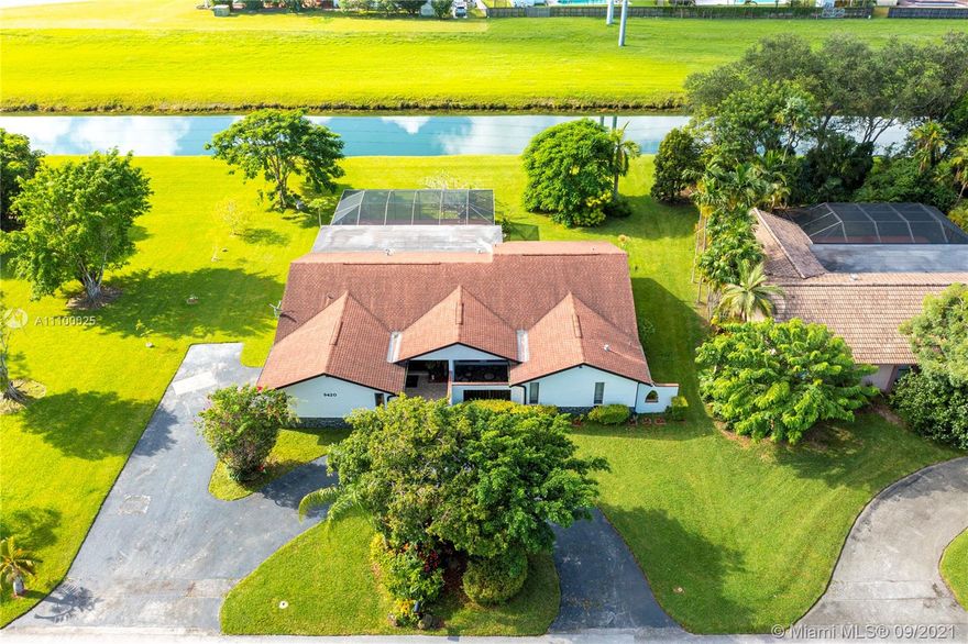 Amazing Location! 4 bedroom 2.5 bath canal front property is situated on a 15,000 K sq ft lot with an additional greenway space behind. Enjoy sunsets and scenic views from the kitchen, family room and pool/patio area. This Spacious home with a large, covered patio and newly resurfaced pool has a circular driveway and 2 car side entry garage that allows for ample parking. Freshly painted with great curb appeal. With a few updates, this home could exceed its current potential. Just a few houses down are the Briar Bay Golf Course and YMCA. Also close by is The Falls Shopping Center, Fresh Market and Publix. No shortage of fruit trees and herbs here. To name a few, Avocado, Moringa, Mint, Parsley, Sage and the list goes on. A must see!