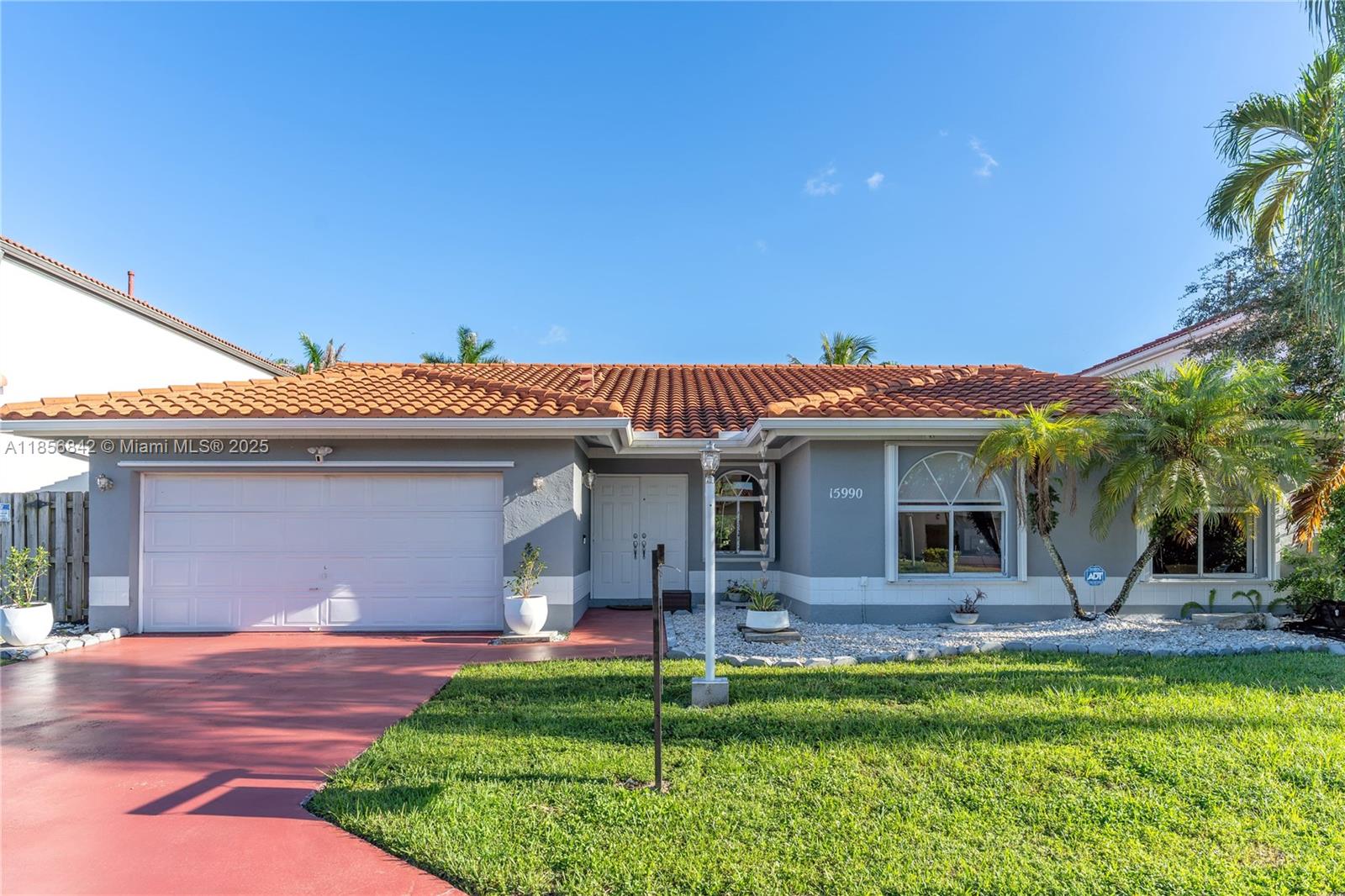 Beautiful 4BR/2.5BA residence with 2-car garage in desirable West Kendall. Enjoy the high ceilings, abundant natural light, and an open layout create a refined, airy ambiance. Generous living spaces and ample storage, including dual attic access, offer both comfort and functionality. Meticulously maintained with premium updates: new roof (2022, permits), 5-ton A/C (2025), new water heater (permit), and upgraded appliances. Hurricane shutters and low HOA add peace of mind. Ideally located near top schools, parks, and upscale shopping. Move-in ready and designed for effortless living.