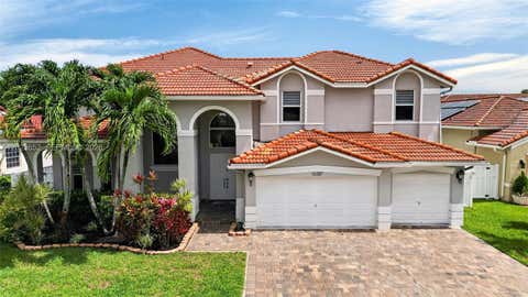 Photo of 16387 NW 13th St, Pembroke Pines, FL 33028 (MLS # A12023652)