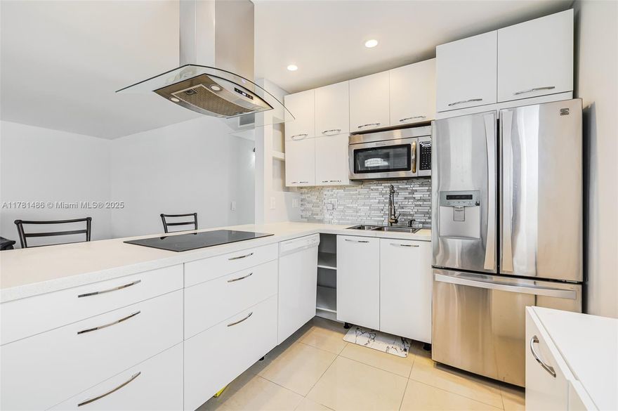 Experience luxury in this beautifully remodeled 2-bedroom, 2-bath condo. With high-end appliances, sleek modern finishes, hurricane-proof front door, & open concept no detail has been overlooked. Enjoy the serene screened-in balcony, walk-in closet in the master, and in-unit washer/dryer. Located in the highly desirable 55+ Kings Point community, you'll have access to two clubhouses, pools, a theater, gym, and a free shuttle. Not to mention, the affordable membership fees make this an incredible opportunity. Minutes from shopping, dining, and just 15 minutes to the beach. - Schedule your tour today!