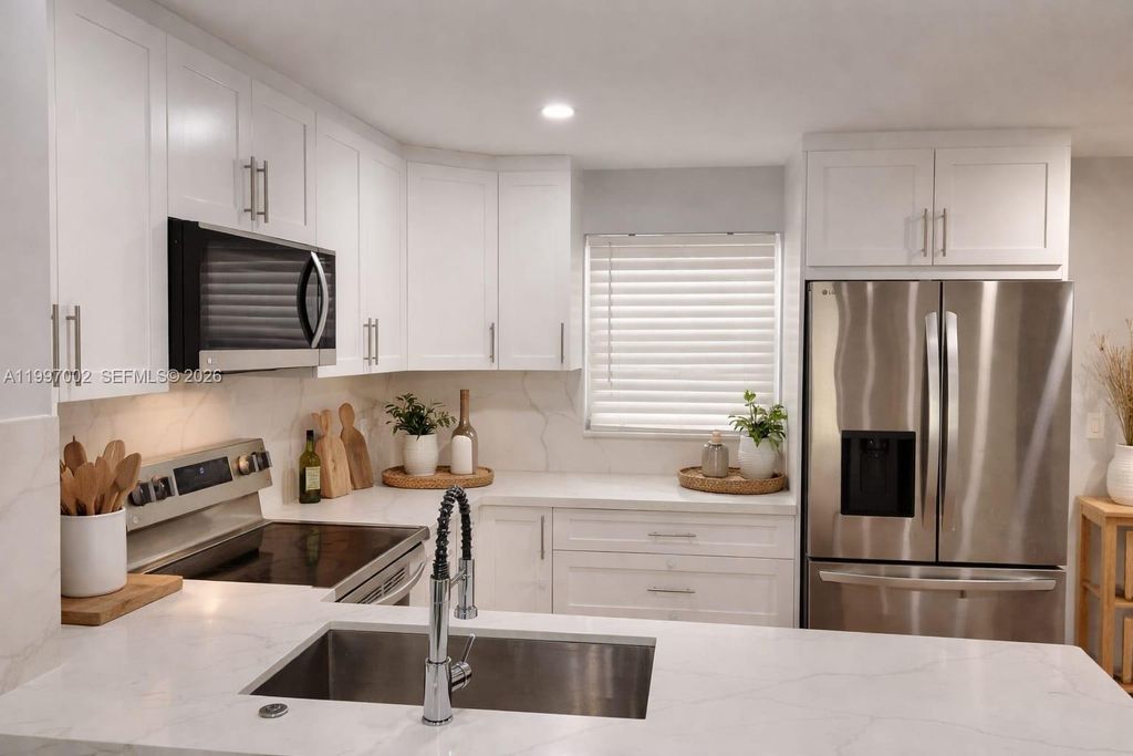 Photo of 2980 Riverside Dr #125-3, Coral Springs, FL 33065 (MLS # A11997002)