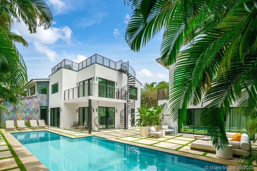 Newly gut renovated by Shear Construction. A gem in the heart of the most desired area in Miami Beach. Over 4,000 SF of lavish living space allows to fabulous entertainment areas, top of the line open format kitchen space, wood wall paneling throughout, a “showcase” glass enclosed garage and a special outdoor/indoor feel. 3 suites upstairs including an oversized master bed/bath with terrace and access to the furnished rooftop deck. Continue outside to the separate guest quarters featuring a large bedroom suite on second level complete with its own kitchen. Below, slide open the “day lounge/nightclub” outfitted with a massive wet bar, DJ booth and full bathroom. This space fully integrates with the outdoor lounge area and heated oversized pool and built in BBQ area.