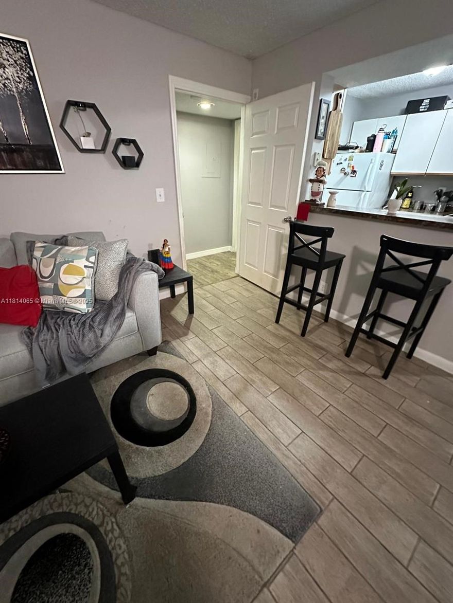 Come see this immaculate kept condo. With wood floors and spacious rooms, this is a must see to believe. Balcony overlooks beautiful greenery, neighborhood is very quiet. Conventional 30% down. Easy to show.