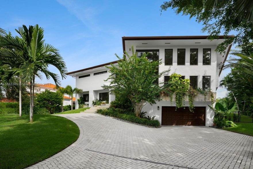 Welcome to Hammock Oaks Harbor—an exclusive, waterfront community of 18 homes, nestled inside the gated Hammock Oaks neighborhood, & beside the breathtaking Fairchild Tropical Botanic Garden.
This fully renovated home is set on an expansive 17,500+sqft lot & includes a deeded 40-ft dock with 1 high-bridge to bay. The residence is showcased by soaring 22-ft ceilings & abundant windows that flood the home with natural light.
The 1,600sqft primary suite features an ante-room, private den, walk-in closet, wood-burning fireplace, & a wrap-around porch. Wine enthusiasts will appreciate the 1,200-bottlecellar, while fitness lovers will enjoy the 600+sqft gym with an attached office/playroom.
At under $900/sf, this home is the least expensive home providing open water access on the market!