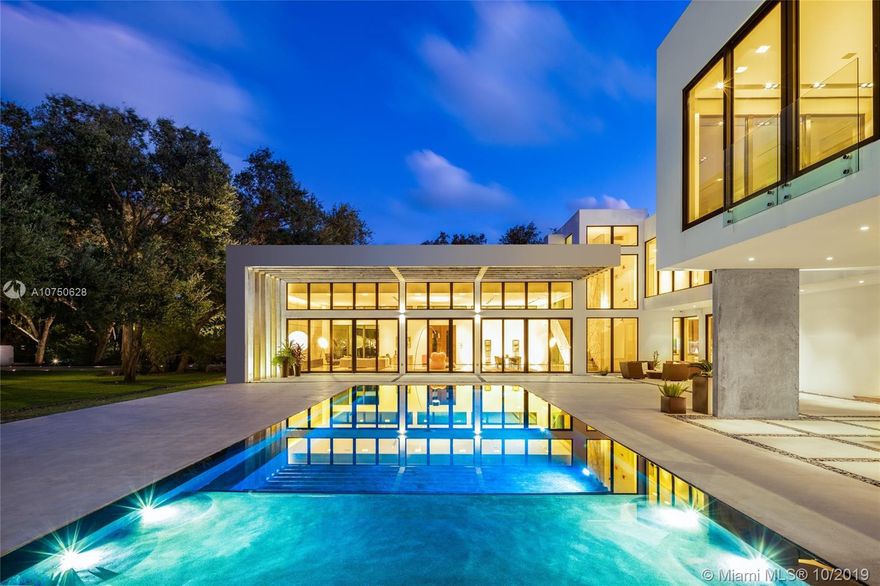 Welcome to your modern multigenerational architectural masterpiece. Designed by international award winning architect Kobi Karp, this family estate is the only of its kind. Built in 2014 featuring 16 ft ceilings and over 10,000 square feet of living space on a 62,726 square foot lot. 7 bedrooms, 7.5 bathrooms, incredibly rare Senso floors, guest house, theater, indoor gym, squash court, college sized basketball court, heated pool, 3-car garage, smart home, Kohler generator, Lutron lighting system, Creston system, Mia Cucina Kitchen, and Wolf Stove Range. Mature oaks surround the property creating a highly coveted architectural effect, combining the flow-through open concept interiors in perfect harmony with the landscape. This highly desirable Utopia is one for the ages to call home