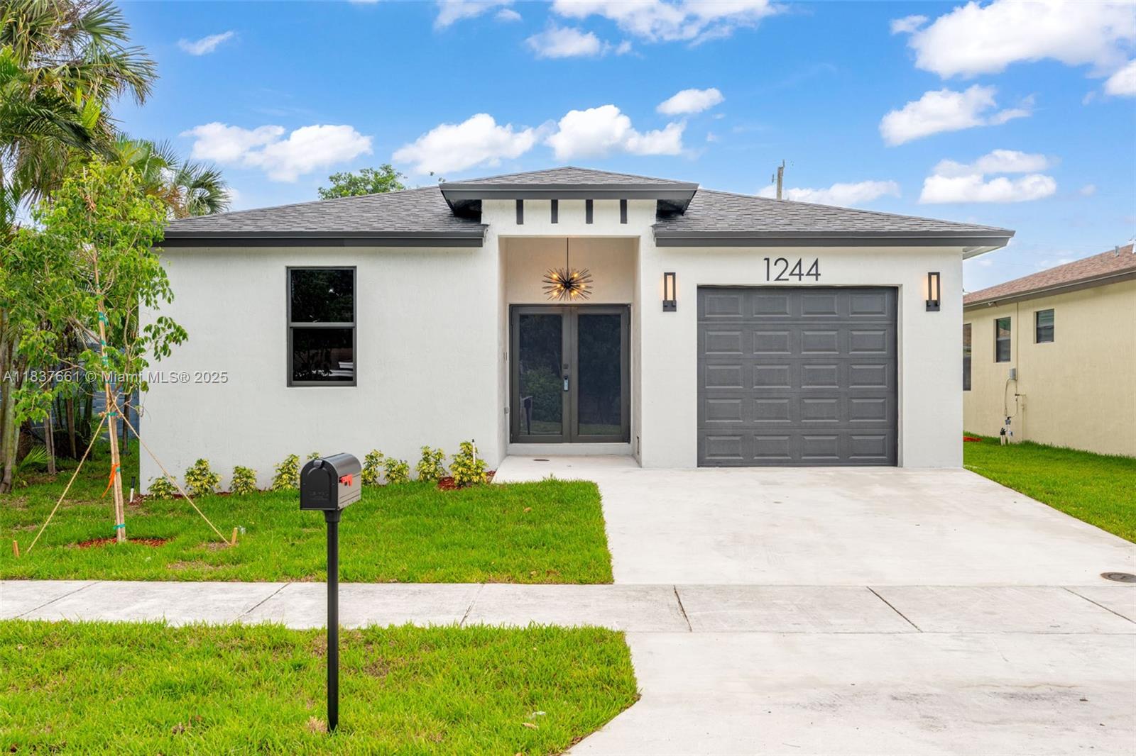 Welcome to your dream home at 1244 Northwest 30th Avenue, Fort Lauderdale, FL. This exquisite new construction home features 4 spacious bedrooms and 2 luxurious baths. The sleek, modern interior is designed for effortless living—just bring your toothbrush! Enjoy an open floor plan with high-end finishes and abundant natural light. The gourmet kitchen boasts top-tier appliances and chic cabinetry. A generously sized backyard offers endless possibilities, including space for a pool. Nestled in vibrant Fort Lauderdale, this home promises a lifestyle of elegance and comfort. Don't miss this modern masterpiece!