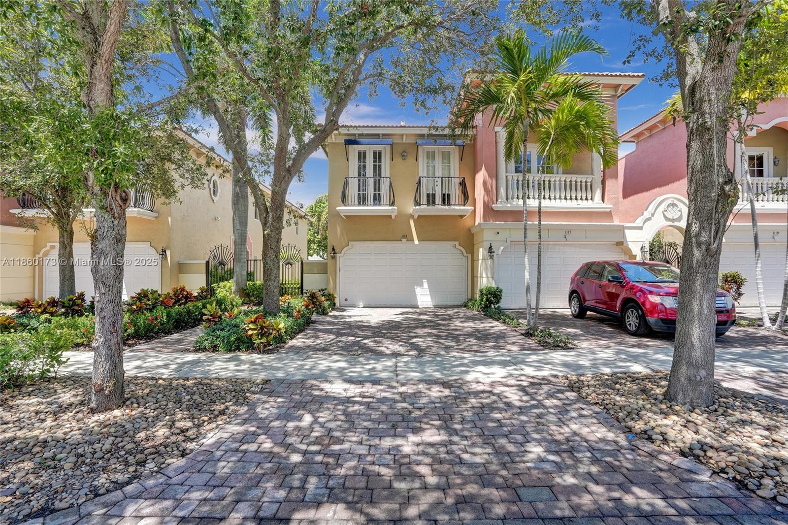 This updated corner townhome combines modern design with comfort, ideal for today’s lifestyle. The open floor plan is filled with natural light, volume ceilings, and sleek finishes. The chef’s kitchen with snack bar offers abundant counter space and flows into the dining area, custom bar, and great room. French doors with impact windows lead to a private tropical retreat featuring an free-form pool, patio, custom BBQ, dining area, lighting, and Bluetooth sound. The primary suite includes two walk-in closets, spa-style bath with Jacuzzi and shower, plus a balcony overlooking the pool. The junior suite has two balconies, and the third bedroom can be used as an office.