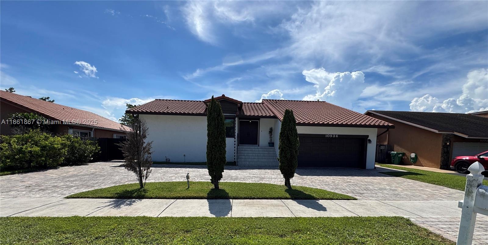 Welcome to 10936 SW 138th Pl, a charming large tri-level POOL home in Miami, FL 33186. This property features a spacious layout with three bedrooms / two and a half bathrooms (plus office). Tiled throughout. The kitchen boasts ample counter space with adjacent family room. View of the pool throughout home. Middle-level Master bedroom and living space leads to an outdoor balcony that descends to pool. It is located in a friendly neighborhood, this home offers convenient access to local amenities, shopping, and dining. Don't miss the opportunity to make this lovely residence your own! Some highlights: - Large HEATED Pool + pavers - Add Storage: Attic and Under House. - Accordion Shutters - 2 Car Garage + circular driveway - 2 AC units for split level comfort - Bathrooms updated