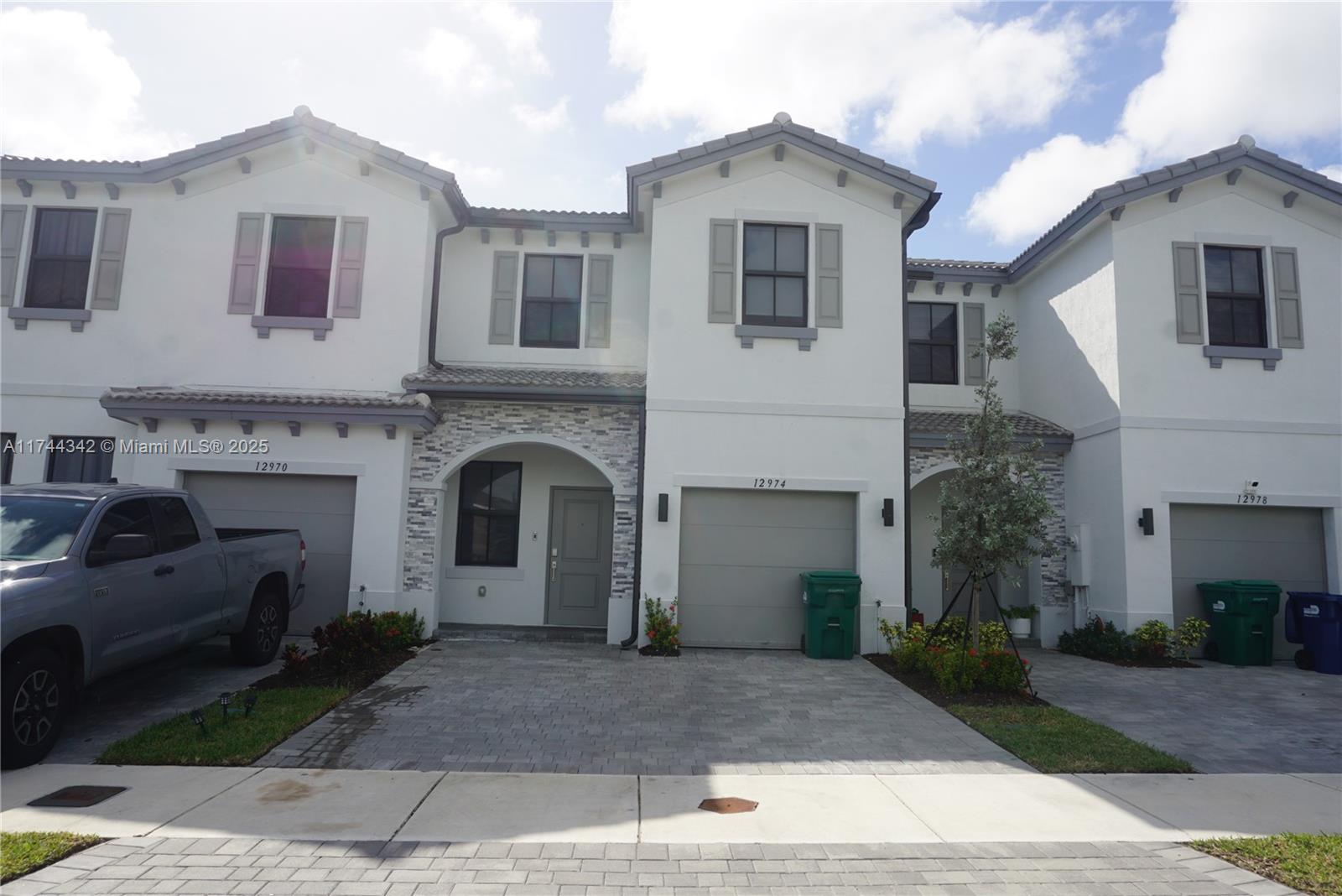 Beautiful Townhouse with 4 bedrooms, 3 bathrooms and 1-car garage. This charming townhouse features: Open floor layout, 1 bed/1 bath on the 1st floor, Ceramic Tile floors on the first floor & carpet on the 2nd floor, modern kitchen with white cabinets, quartz counters & stainless steel appliances, spacious primary bedroom with walk-in closet, primary bathroom with dual sinks & large shower w/glass doors, laundry room with full size washer & dryer, family room & nicely landscaped fenced-in patio! Parking for up to 4 cars, plus guest parking. Ready to Move