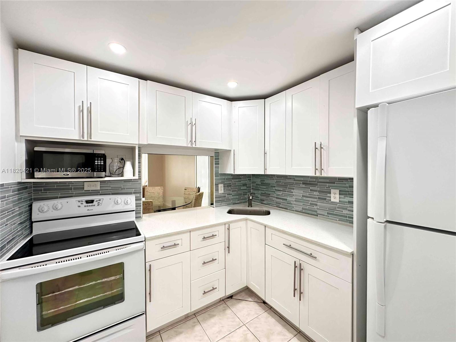 AVAILABLE JULY 1ST – LONG-TERM RENTAL ONLY! Step into this beautiful 1 BED / 1 BATH condo that’s designed to WOW! With an abundance of SPACE and NATURAL LIGHT, you'll feel right at home. Relax on your CHARMING SCREENED BALCONY and soak in the PEACEFUL VIEWS! Featuring TILE & WOOD FLOORING THROUGHOUT and a REMODELED KITCHEN, this condo blends STYLE & FUNCTIONALITY effortlessly. Located in the prestigious THREE ISLANDS community, enjoy access to a WATERFRONT POOL, TENNIS COURTS, CLUBHOUSE, and a CONVENIENT HALLANDALE BEACH CITY SHUTTLE. Plus, you're just MINUTES FROM THE BEACH, GULFSTREAM VILLAGE & CASINO, SHOPPING, DINING, AND AIRPORTS—everything you need for the ultimate COASTAL LIFESTYLE! Don’t miss out—this gem WON’T LAST!