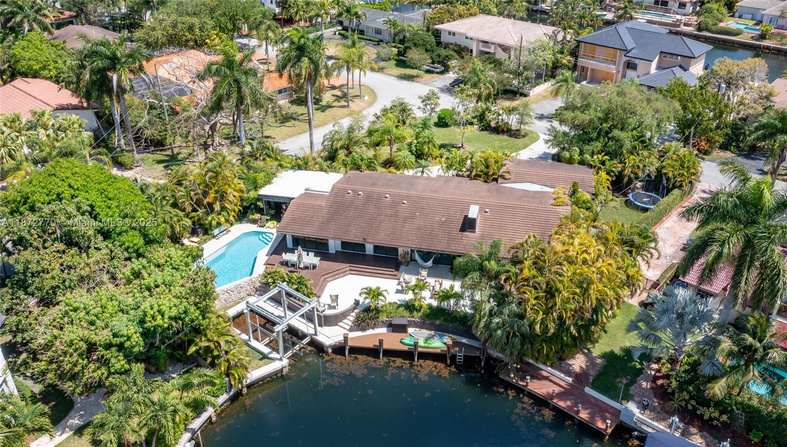 Renovated in 2018, this modern residence in guard-gated Gables by the Sea offers canal access with private dock and 10,000 lb. boat lift for vessels up to 30 ft. Just 5 minutes to the bay, ideal for boating.
Home features 4 bedrooms, 3.5 baths, and an open 3,376 sq. ft. floor plan with natural light. Kitchen includes quartz countertops and SubZero/Wolf appliances. Additional finishes: porcelain tile floors, impact windows/doors, LED lighting, Ipe decks.
Outdoor areas include pool, pergola with full kitchen, and watersports launch. The remodeled 2-car garage doubles as playroom or lounge.
Located near top private schools including Gulliver, offering waterfront lifestyle with family convenience.
Note: All measurements approximate; buyer to verify. Subject to survey.