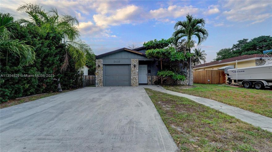 Fantastic 4 bedroom 2 bath w/ 1 car garage single family home located in Hollywood Little Ranches!! Almost 1600 sq ft under air and the lot size is 10000+ sq ft. Completely remodeled. Home features updated tile floorings. Open kitchen w/ white cabinetry, granite countertops & stainless steel appliances. Large kitchen island w/ ample room for bar stools. Impact glass! New roof! Large driveway accommodates multiple cars. Huge backyard! This is a must see!