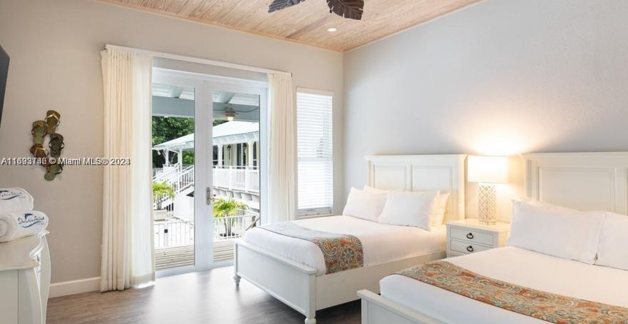 Gorgeous waterfront boutique hotel.  2.6 acres on wide bay. There is a peninsula, marina, boat ramp, beach, 2 pools, kayak and paddle board area. Each of the 6 buildings has 2 to 3 story ceilings. There are 8000 sq ft. Of covered wrap around patios. Built above code and completed at end of 2017. The rooms are large, with full kitchens and laundry rooms. The villas have attached lock out suites. Beautiful landscaping. Sleeps 64 with lots of entertainment areas.