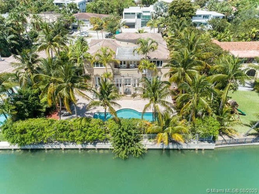 Custom built waterfront home on an oversized property encompassing 1.5 LOTS/14,773 Sq FT  WITH  99FT ON THE WATER.  Offered for the first time, built w/ great attention to detail. Fabulous layout features magnificent 2 story entrance foyer w/ sweeping staircase leading to 5 large bedrooms, Master has 2 oversized walk-ins, sitting area , balcony, state of the art whirlpool & separate shower.  Entertain in the huge formal dining room w/ water views. Chefs kitchen w/fine custom cabinetry, Subzero refrigerator & freezer, 3 ovens, 2 dishwashers & two sets of gas burners . Other rooms include  family room, office w/separate entrance, guest room/bath & second kitchen. Abundant storage not typical in most newly built homes. Take advantage of outdoor living w/ large patio, trellis & heated pool.