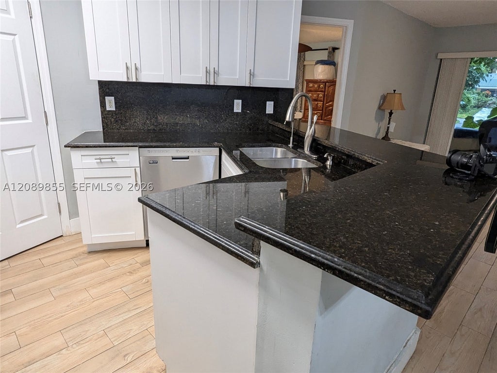 Photo of 9999 Summerbreeze Dr #513, Sunrise, FL 33322 (MLS # A12089855)