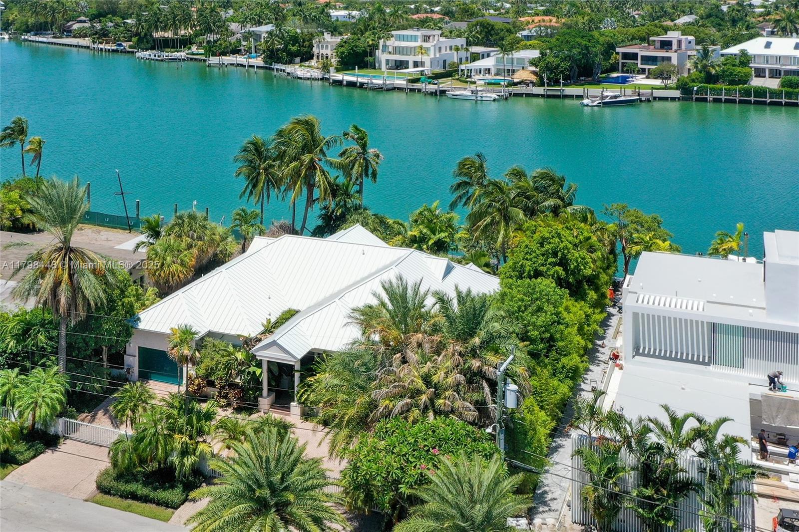 Coveted waterfront location in Key Biscayne! Boater’s paradise with wide water views overlooking Hurricane Harbor. This elevated 1-story residence offers 5 spacious bedrooms, 5 bathrooms. Enjoy a large living room, formal dining area. The primary suite boasts serene views of the harbor. A grand reception area with soaring ceilings leads to a large covered terrace through double doors, seamlessly connecting to the pool, garden, and private dock. Includes a 1-car enclosed garage. Rare opportunity to live on the water in one of the island’s most desirable addresses.