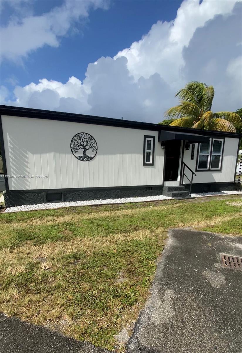 Beautiful maintained double wide mobile home in the Highly Sought after Royal Country Mobile Home Park. This 3/2 home is COMPLETELY REMODELED and offers an open living room space. Kitchen has marble counter tops and all stainless-steel appliances. Bathrooms offer plenty of storage space. Covered outside terrace offers a small kitchenette for all of those that like to cook outside. Home is being sold with all new brand-new furniture with the exception of the bedroom set. This house is in perfect conditions