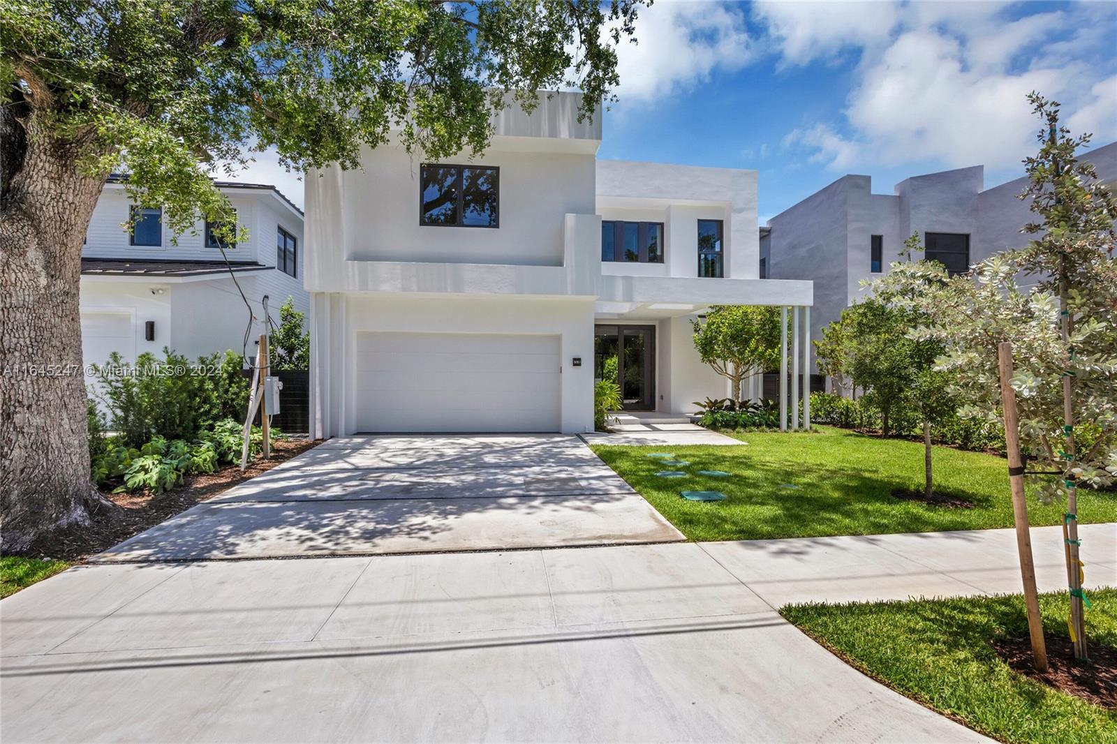 Introducing a stunning new construction marvel in the idyllic neighborhood of Ponce Davis. This 2-story, 5-bedroom, 5.5-bath home embodies tropical modernism with luxury finishes. The ground floor features a state-of-the-art kitchen with high-end finishes seamlessly connected to the family room, bedroom suite and a 2-car garage. The second floor boasts a lavish master suite with dual walk-in closets, large balcony, a spacious den, and convenient laundry room. Outside, an expansive backyard oasis awaits, complete with a stunning pool, summer kitchen, and lush tropical landscaping. Full impact glass w/ whole-house generator + underground gas tank makes this home storm ready. Minutes from Downtown Coral Gables and The Shops at Sunset Place.