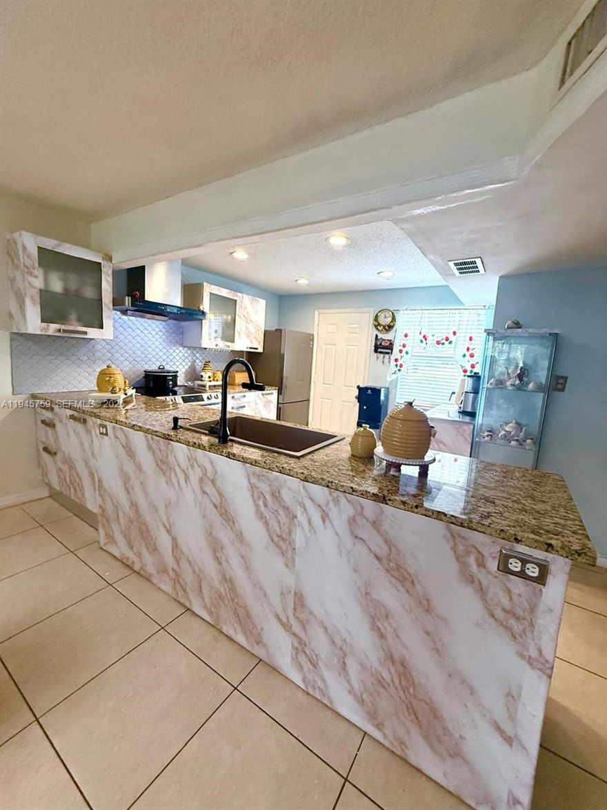 Charming 1BR/1.5BA Condo!
Bright and spacious unit featuring a custom open kitchen with breakfast bar, tastefully updated bathroom, tile flooring throughout, and a private balcony. Includes assigned parking in a well-maintained, quiet building. One of the few affordable opportunities in a neighborhood surrounded by million-dollar homes and new luxury developments, with the lowest HOA in the area.                           Special assessment paid by Seller. A must-see, schedule your showing today!