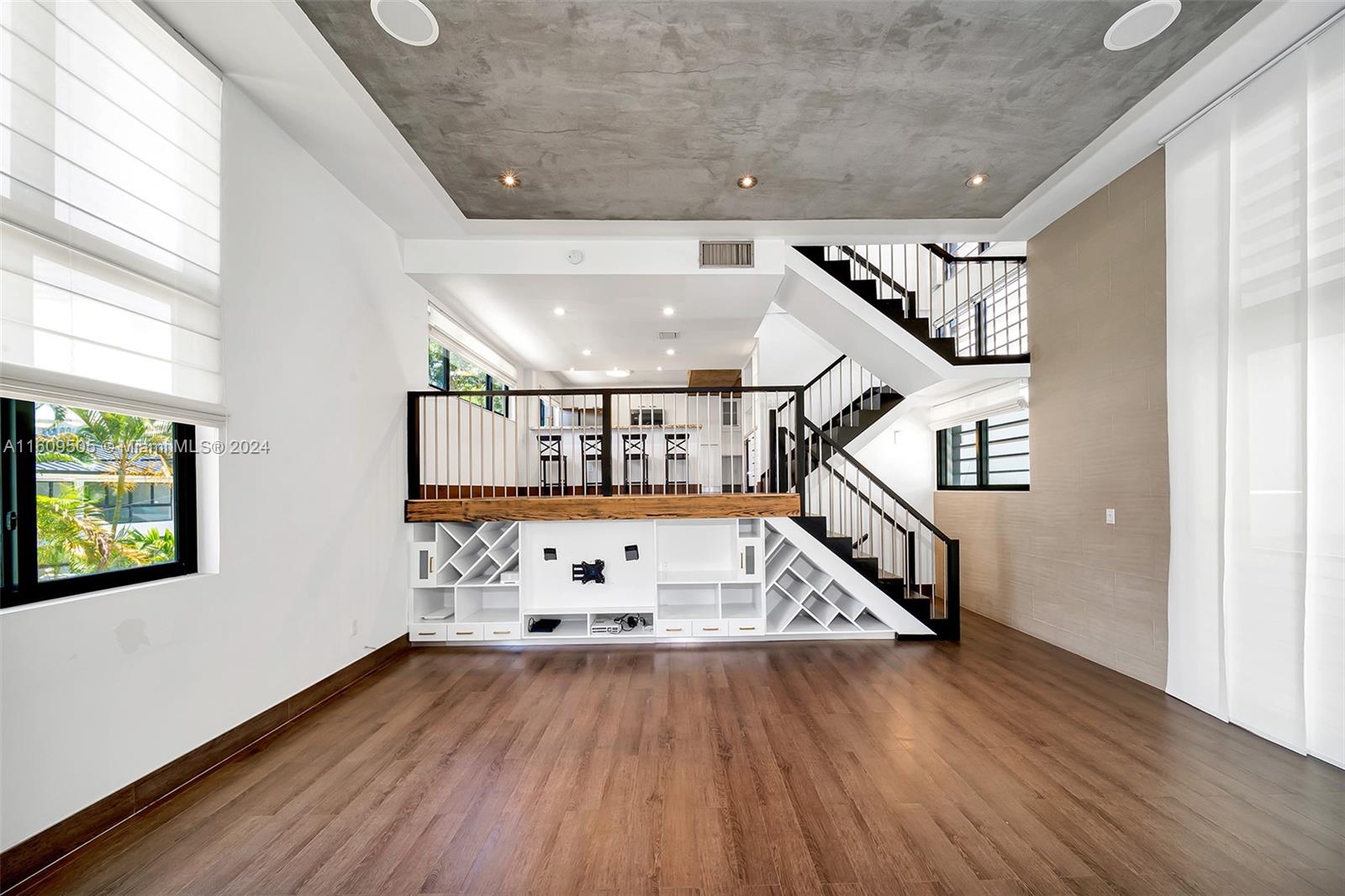 This charming townhouse offers the perfect blend of space, comfort, and beach-style living. This multilevel home has ample space for relaxation and entertaining. Features large impact windows and doors as well as soaring 25ft ceilings that bring in natural light. The bright and airy layout seamlessly transitions between living, dining, and kitchen areas, creating an inviting atmosphere for gatherings with family and friends. Beautiful private outdoor patio, wehre you can enjoy al fresco dining. Convenient two-car covered garage, ensuring space for vehicles, storage, and more. Highly desired for its proximity to amenities with the pool, BBQ, kids playground, and to the beach, school, restaurants, and shops. SPECIAL ASSESSMENT PAID BY THE CURRENT OWNER.