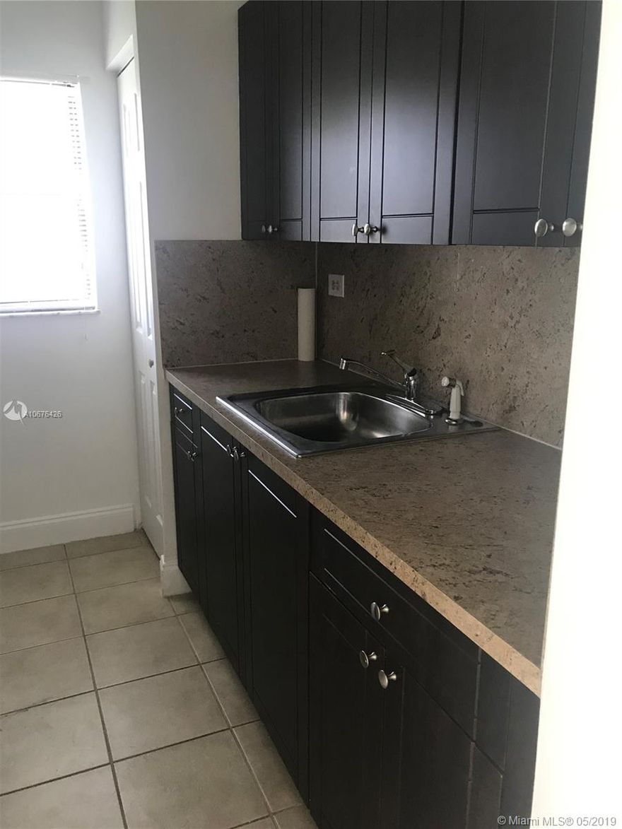 Very well kept and updated in the heart of Miami Lakes. A must see. Gated community, close to shopping centers, main highways, schools. Common laundry area.