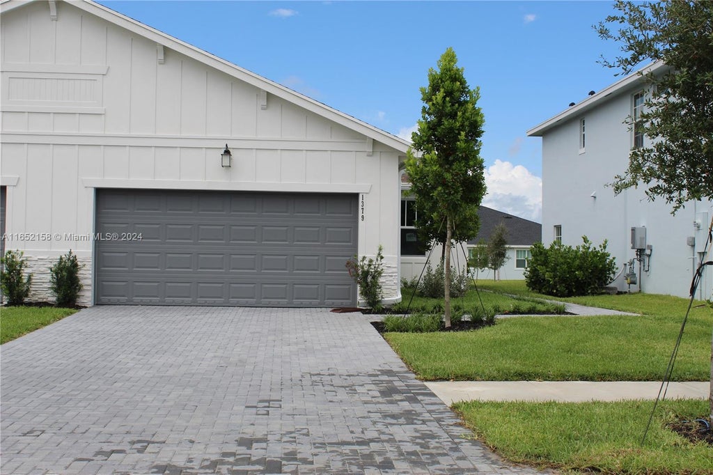 Photo of 1379 Tangled Orchard Trce #0119, Loxahatchee, FL 33470 (MLS # A11652158)