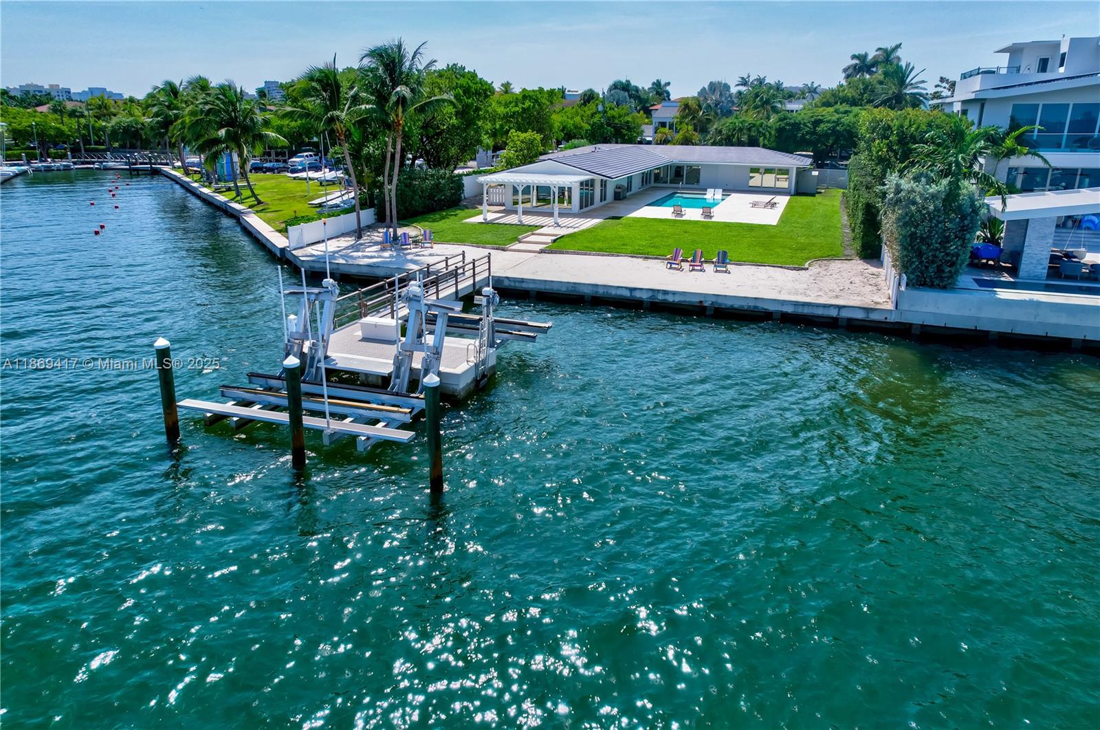 Breathtaking skyline views of Miami while enjoying the saltwater pool or relaxing on your own private man-made beach. Inside, elegant marble floors, expansive impact glass windows, and an open-concept kitchen create a bright and sophisticated living space. Each of the four bedrooms offers its own en-suite bath for the ultimate in privacy and comfort. A spacious two-car garage completes the home.
From your backyard directly into the water—perfect for boating, kayaking, or paddleboarding. This Key Biscayne jewel blends elegance, comfort, and prime location, offering the ultimate island lifestyle.
Currently rented until December 1, 2025.