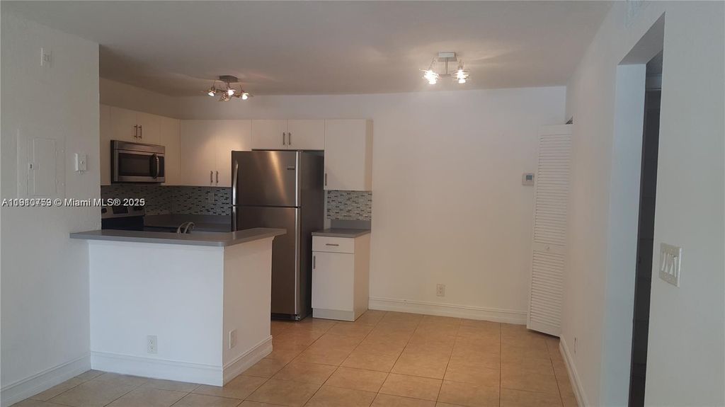 Photo of 731 Lyons Rd #16103, Coconut Creek, FL 33063 (MLS # A11910759)