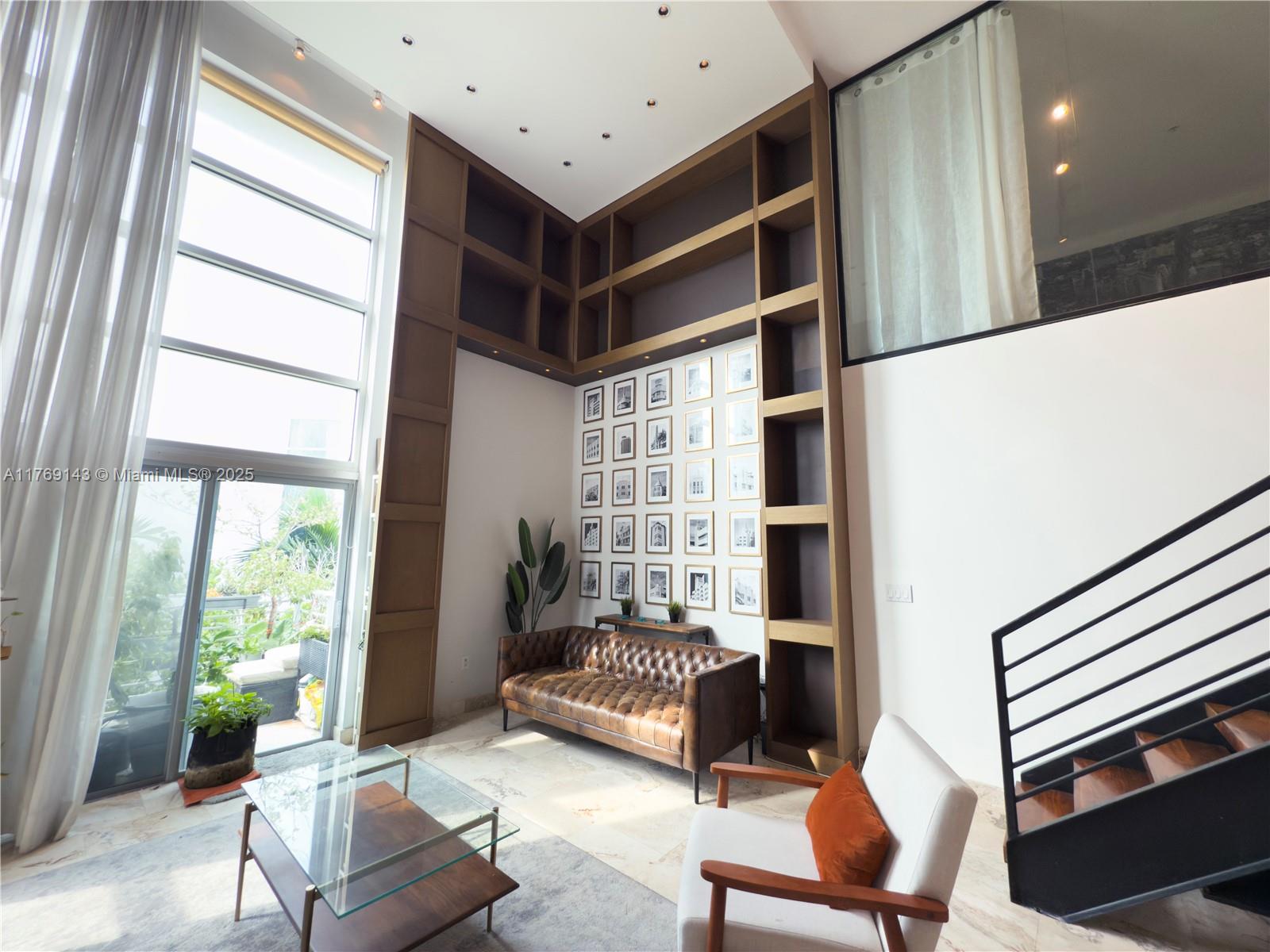 This stunning loft style 2/2 is only a few steps from the ocean! A unique, chic beach condo features a newly remodeled kitchen; an assigned parking space in a secure, covered garage; magnificent 19" ceiling with an designer 19" custom wall unit bookcase, partial ocean view; two balconies; floor to ceiling hurricane impact windows; private rooftop sundeck with direct ocean views, as well as a shared rooftop pool. High speed internet included! Located in North Beach, the most up and coming neighborhood in Miami Beach. Steps from grocery stores, restaurants, the MB Bandshell venue, schools, houses of worship, nature parks, and directly across from the beach. Minutes from the causeways, South Beach, and the Bal Harbour Shops. The ultimate, peaceful, PRIVATE, luxury beach living!