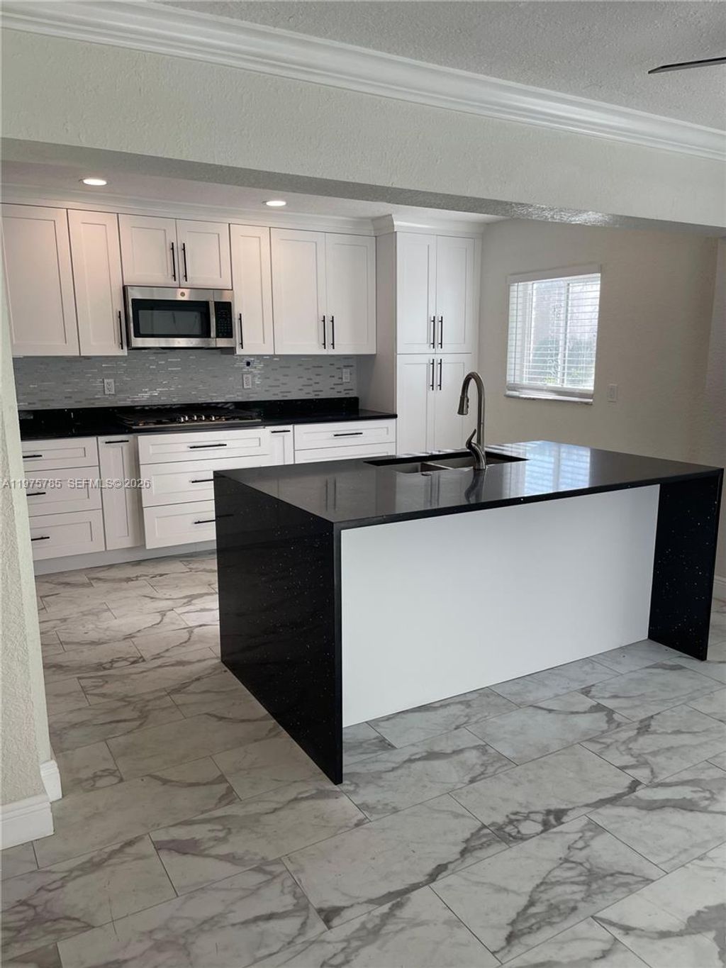 Photo of 365 NW 4th Ct, Deerfield Beach, FL 33441 (MLS # A11975785)