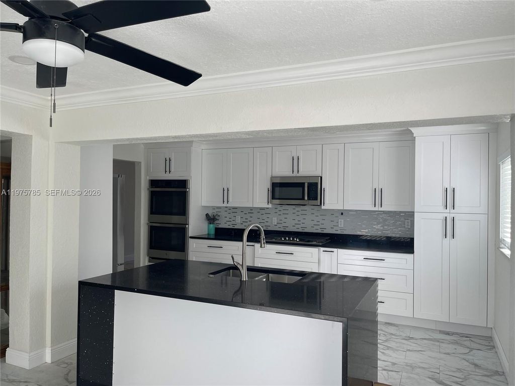 Photo of 365 NW 4th Ct, Deerfield Beach, FL 33441 (MLS # A11975785)