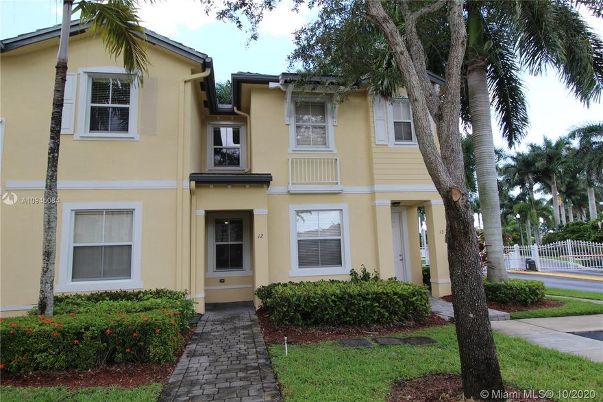 Hurry if you don't want to miss this great deal on a 3-bedroom,2.5 bathroom townhouse in the gated Fiji community! The fully equipped open kitchen has a snack counter and overlooks the family room. The living room also opens to the kitchen. All three bedrooms are upstairs. In the spacious master bedroom, there is a tray ceiling, and a walk-in closet. The open yard at the back has a storage room, a patio with stone pavers, concrete patio furniture, and a lake view. Fiji is in the popular Oasis development, with easy access to schools, hospitals & the turnpike. It has a beautiful clubhouse and recreation facilities, with membership optional. This home just needs a little refreshing and a new owner's personal touch. Check this one out before it's gone!