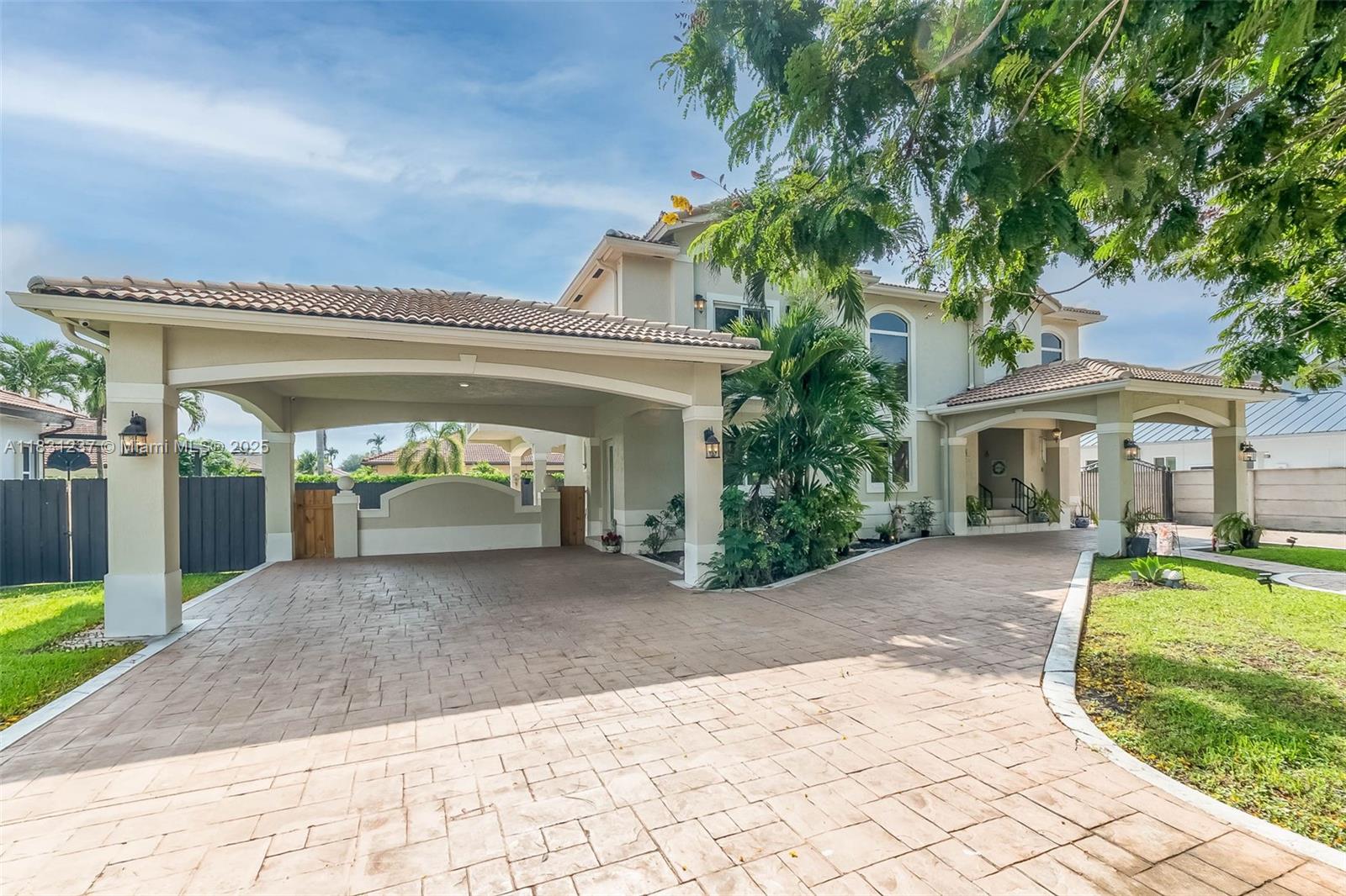 A Home of Distinction! This custom-designed Mediterranean style home, was originally built by an owner/contractor without sparing any details. Located in Barima Estates and sitting on an oversized lot boasting over 10,000 sqft, this home offers convenience and space for a future pool and/or to park a recreational vehicle. Fully fenced and gated. Home features a circular driveway with a "porte-cochere", leading to a foyer and to a master staircase, with custom iron work handrails and veranda. Solid concrete slab on the second floor, private residential elevator, recently remodeled and updated kitchen with breakfast nook. Enjoy a spacious layout, a formal dining, large family room, full bedroom with bathroom on the first floor, tiled roof, tiled floors throughout, no association.