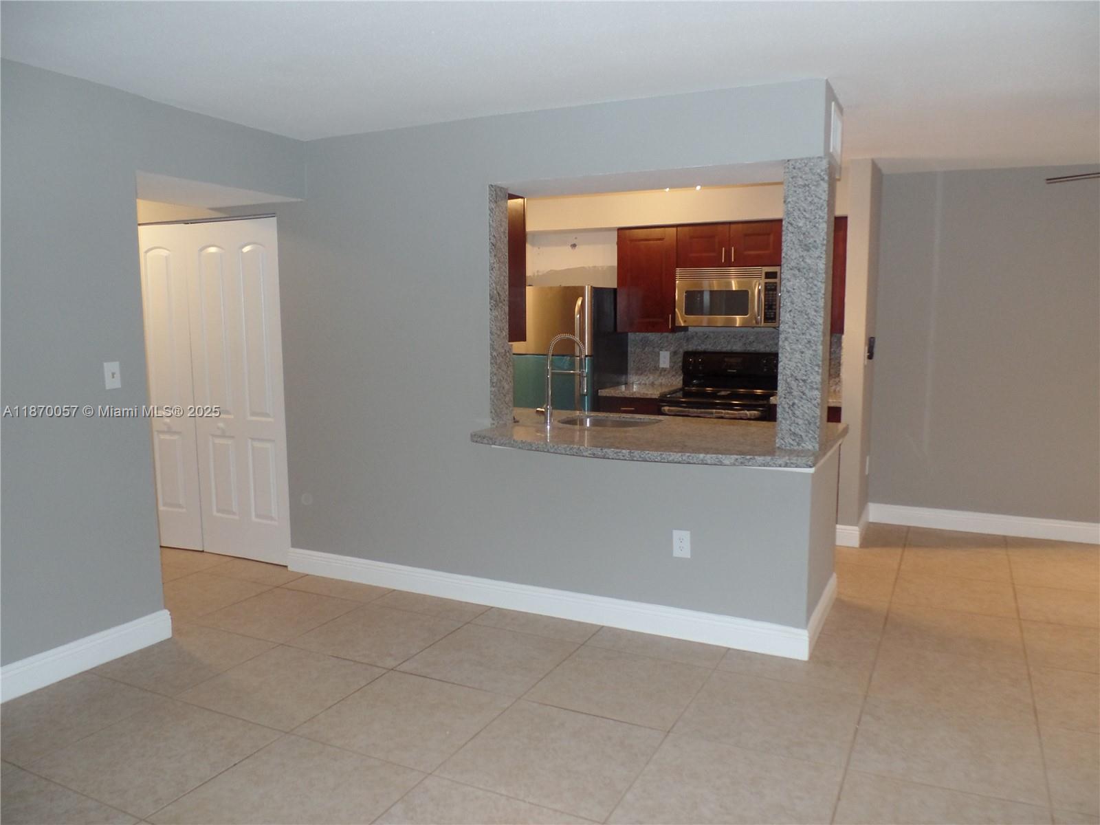Hidden gem in gated Sailboat Pointe community! Beautiful 40-acre pocket area with privately owned condos surrounded by lakes, canals, and tree-lined streets. This renovated unit features in-unit W/D, private lake view, screened patio, east-facing for natural light, granite counters, modern ceiling fans with fixtures. Lush landscaping provides great shading for walking. Resort amenities include pool with view, oversized Jacuzzi, clubhouse with granite bar, full refrigerator, flat-screen TV, tennis courts, fitness center. Security gates and cameras. Prime location just off I-95, close to downtown, beach, west of Wilton Manors, walking distance to shopping. Big dog friendly with no pet deposit or fees. Available immediately with reduced move-in costs for excellent credit.