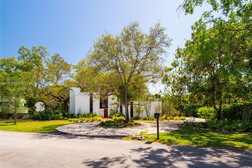 In an era of mass-produced homes, an exceptional opportunity awaits to own the first architectural creation of Charles Harrison Pawley. Designed during a period when Pawley was exploring the dramatic sculptural potential of concrete forms, this residence became the signature project that launched his celebrated career. Tucked within the prestigious Pinecrest enclave of Devonwood, this historic 4 bed/2.5 bath mid-century home captivates with its striking interplay of concrete and glass. Set on a lush half-acre, the house seamlessly connects to the natural backyard hammock through a dramatic two-and-a-half-story wall of glass, immersing the interior in greenery and light. Handcrafted materials define the interiors, including clay floors & exquisite woodwork, along with extensive built-in cabinetry. The exceptional craftsmanship was executed by renowned Swiss carpenter Fritz Gerber, while custom Mexican onyx furnishings were created by Enzo Vincente Gallo at the beginning of his own distinguished career. Over the past six decades, the home has been featured in numerous publications. Devonwood is one of the most desirable neighborhoods in this part of Miami-Dade, known for its dense tree canopy and estate-like privacy. The area sits on what was once Warwick Hammock, a remarkable collection of mature hardwoods and lush vegetation. Nearby are Fairchild Tropical Botanic Garden, Matheson Hammock Park, and the shops and restaurants of Coral Gables and South Miami. A Very Special Home.