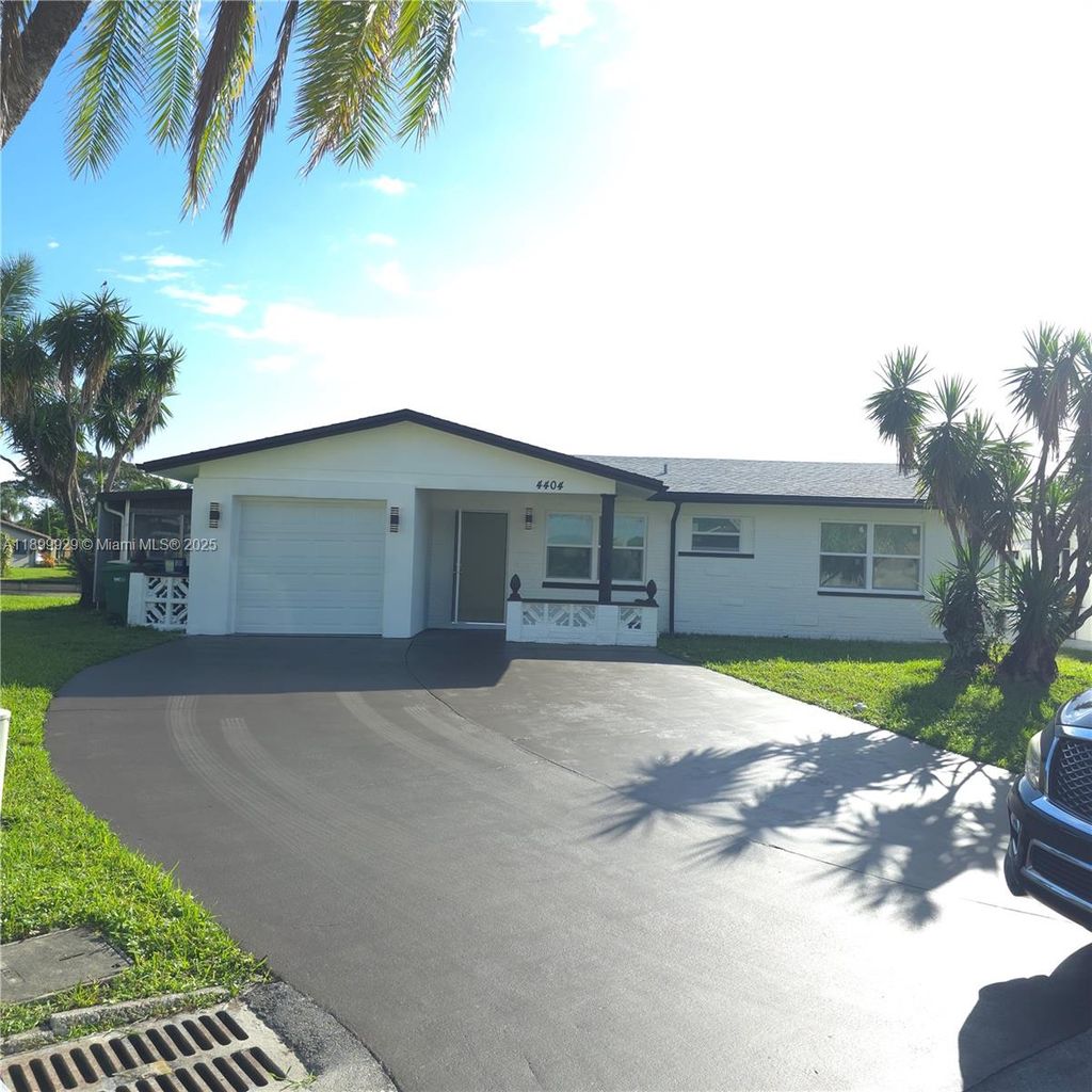 Photo of 4404 NW 46th Way, Tamarac, FL 33319 (MLS # A11899929)