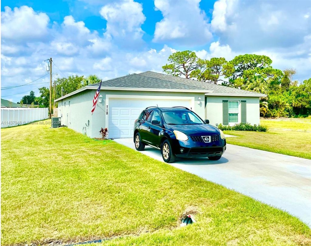 Photo of 718 NE Perch Ln, Port Saint Lucie, FL 34983 (MLS # A11437948)