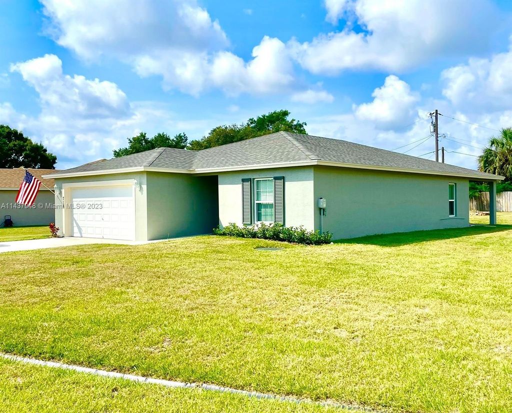 Photo of 718 NE Perch Ln, Port Saint Lucie, FL 34983 (MLS # A11437948)