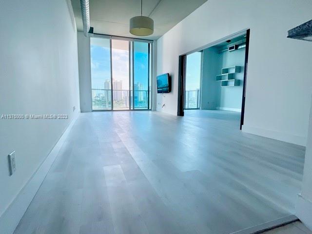 SPACIOUS LOFT IN THE HEART OF AVENTURA WITH 11’ CEILINGS AND FLOOR TO CEILING HIGH IMPACT WINDOWS OFFERING SPECTACULAR FLOW THROUGH WATER AND CITY VIEWS. THIS 3 BEDROOM AND 2 BATH 1362 SQ FT RESIDENCE FEATURES 2 TERRACES, EXPOSED CONCRETE CEILINGS, PORCELAIN TILE AND LAMINATE FLOORS. THE BUILDING OFFERS A RANGE OF AMENITIES: HEATED SALT POOL, JACUZZI, FITNESS CENTER, SAUNA, STEAM ROOM, TENNIS COURT, BASKETBALL COURT, BUSINESS CENTER, LOUNGE, VALET, 24 HOUR SECURITY & PRIVATE MARINA. PET FRIENDLY BUILDING, BASIC CABLE AND HIGH SPEED INTERNET INCLUDED IN THE MAINTENANCE. EXCELLENT LOCATION- WALK EVERYWHERE: PUBLIX, RESTAURANTS & AVENTURA MALL ARE MINUTES AWAY, BEACH IS JUST A 5 MINUTE DRIVE.