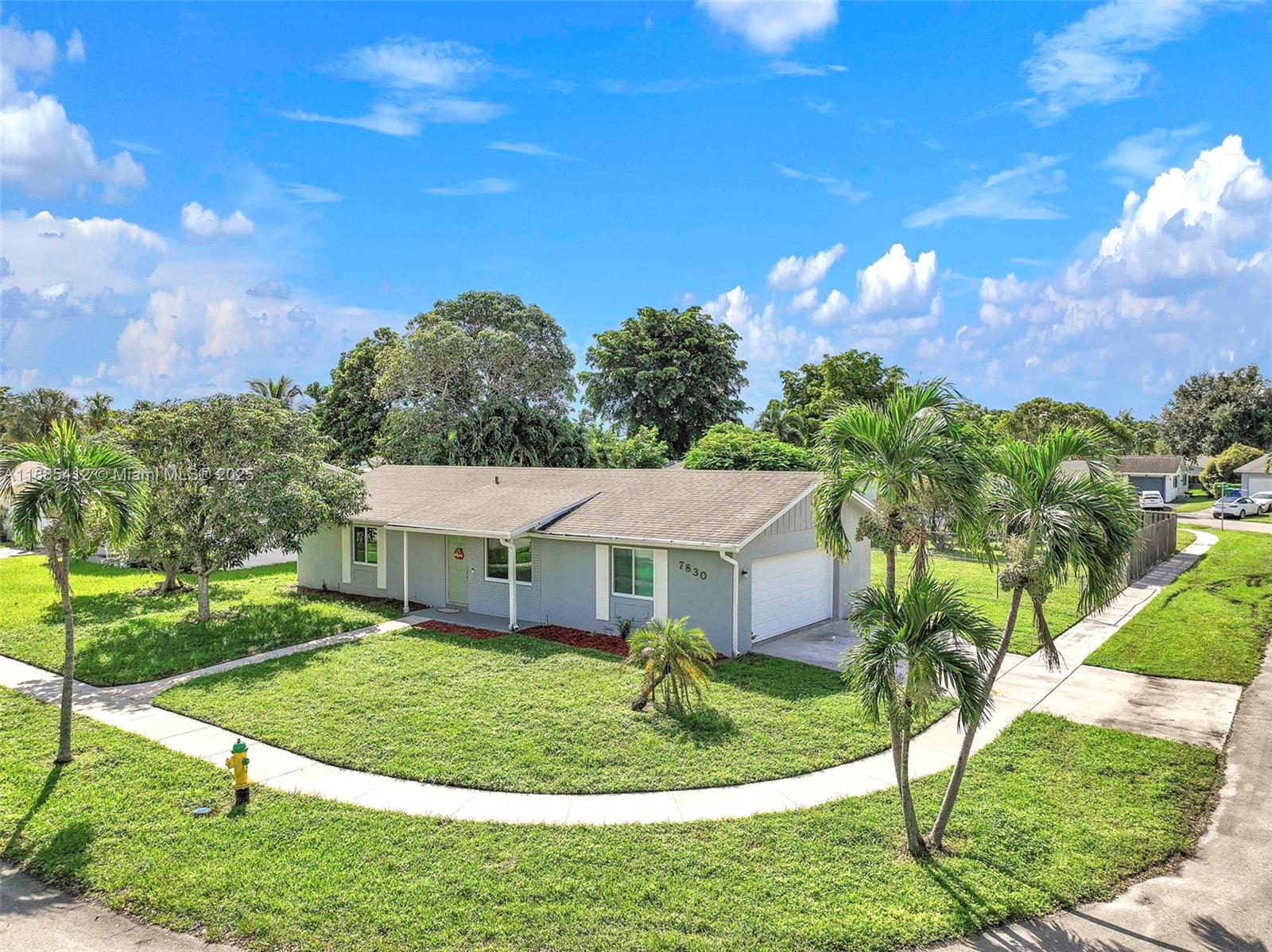 BRING ALL OFFERS!! Beautifully updated home on a LARGE CORNER LOT w/huge private fenced yard & plenty of room for a pool! Major upgrades: NEW ROOF (2020), IMPACT WINDOWS/DOORS (2025), S.S. APPLIANCES (2025), A/C (2023), & EXTERIOR ELECTRICAL PANEL (2025). Inside, the open-concept showcases a modern kitchen w/island, white shaker cabinets & Quartz countertops. Both oversized bedroom suites feature walk-in closets & bathrooms, while the oversized 2-car garage offers the option to convert additional living space or 3rd bedroom if desired. Filled with natural light, this home is designed for comfort & style. Enjoy sidewalks & street lights throughout the neighborhood, perfect for walks any time of day. NO HOA! Close to parks, shopping, & dining. This home truly has it all! MUST SEE TODAY!!