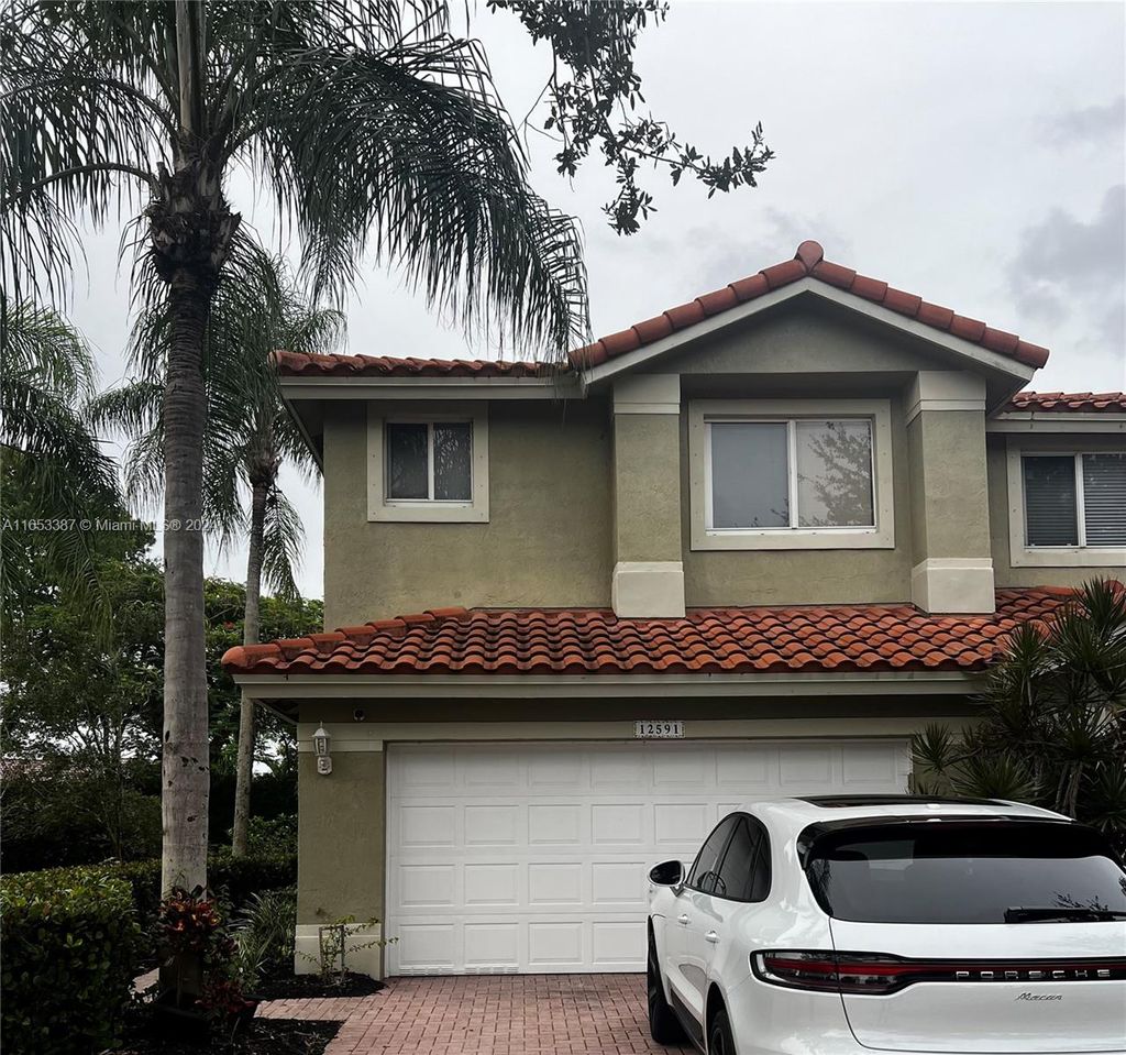 Photo of 12591 NW 57th Pl, Coral Springs, FL 33076 (MLS # A11653387)