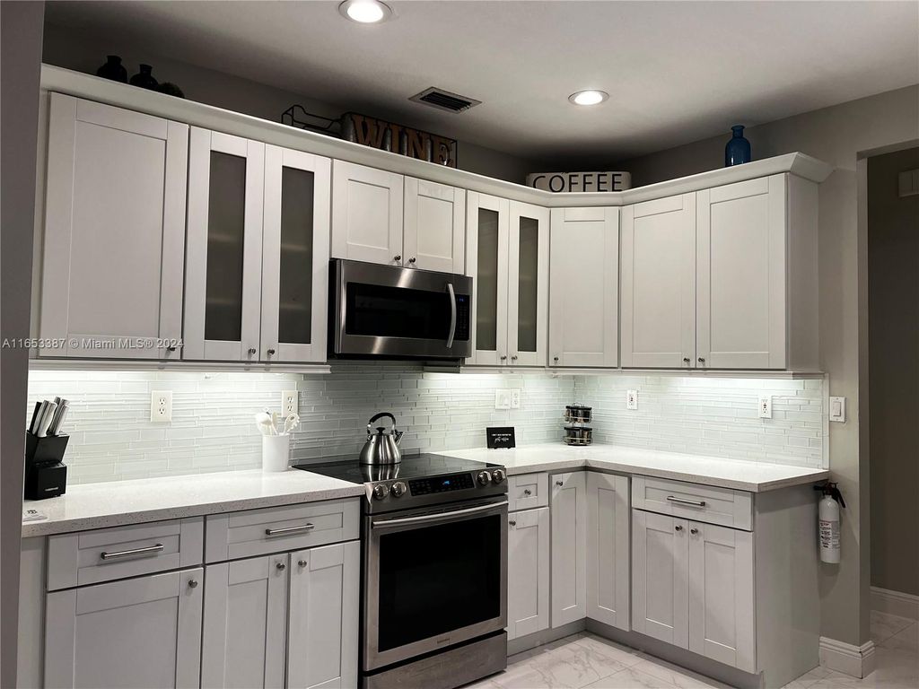 Photo of 12591 NW 57th Pl, Coral Springs, FL 33076 (MLS # A11653387)
