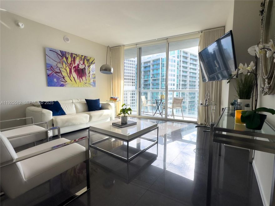 Enjoy stunning views of Brickell Ave, Miami River, and downtown from this stylish one-bedroom condo in Icon Brickell. Thoughtfully designed, it features a spacious walk-in closet, modern high-quality furniture, and a full-size washer and dryer. The sleek kitchen boasts Italian cabinetry and premium appliances from Wolf, Subzero, and Bosch. This residence is perfect for living or investing, with the added flexibility of daily rentals allowed. Icon Brickell Tower 3 offers exceptional amenities such as: Expansive Pool Deck with spectacular landscaping and bay views; State-of-the-Art Fitness Center: steam rooms, saunas, locker rooms, an aerobic studio; Full-Service Spa; On-Site Dining: Two bayfront restaurants, including the renowned Cipriani; Concierge and Valet Services.