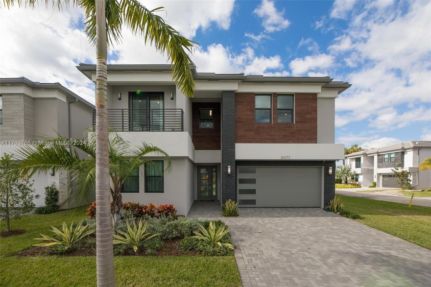 Experience luxury in the sought-after Lotus Palm with this stunning Polynesia model, the largest in the Fiji Collection, on a spacious corner lot with lots of private parking. With 5,506 sq. ft. of living space on a huge 9,540 sq. ft. lot, this home features soaring ceilings, hardwood floors, and large windows filling the space with natural light. The chef’s kitchen boasts a quartz island, sleek countertops, and stainless steel appliances, while the primary suite offers dual bathrooms and breathtaking sunset views. Residents enjoy the brand-new Lotus Palm Clubhouse with tennis, pickleball, a restaurant, poolside bar, fitness center, and more. Conveniently near Glades Road, top-rated schools, and Boca’s best shopping, dining, and entertainment—don’t miss this rare corner lot opportunity!